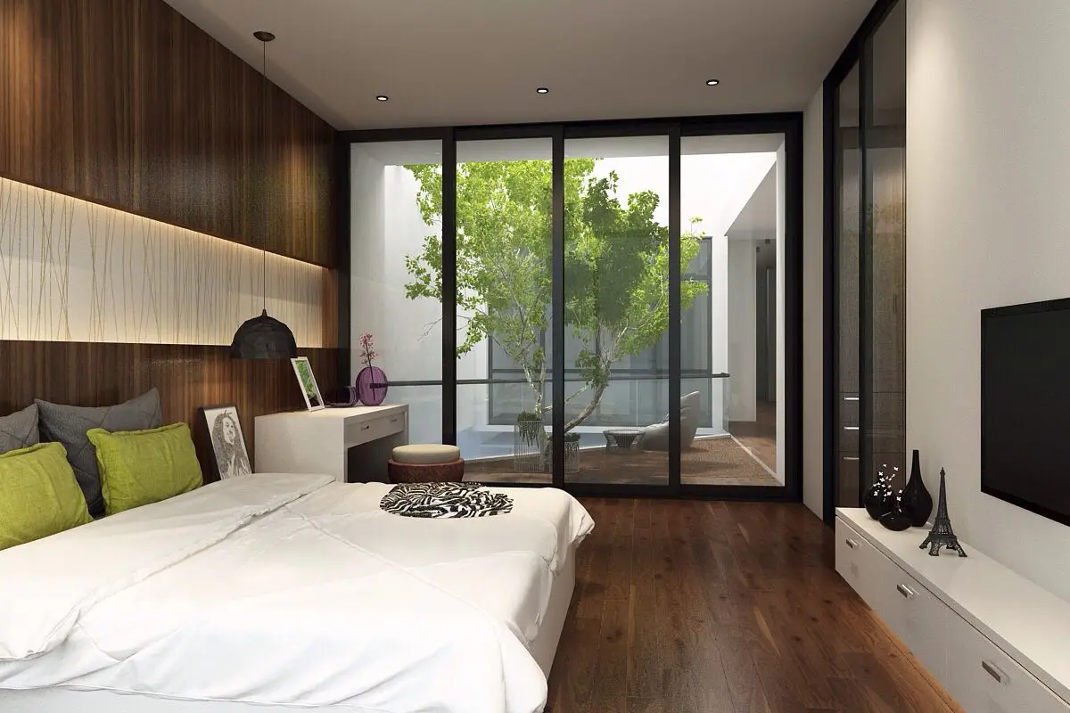 Cửa kính lấy ánh sáng tự nhiên trong thiết kế nội thất phòng ngủ nhà phố